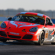 Straus’ No. 18 Porsche Cayman race car in the IMSA Continental Tire SportsCar Challenge, after she was told she’d never be aggressive enough to get the hang of this kind of thing. Photo credit: Wes Duenkel, used with permission